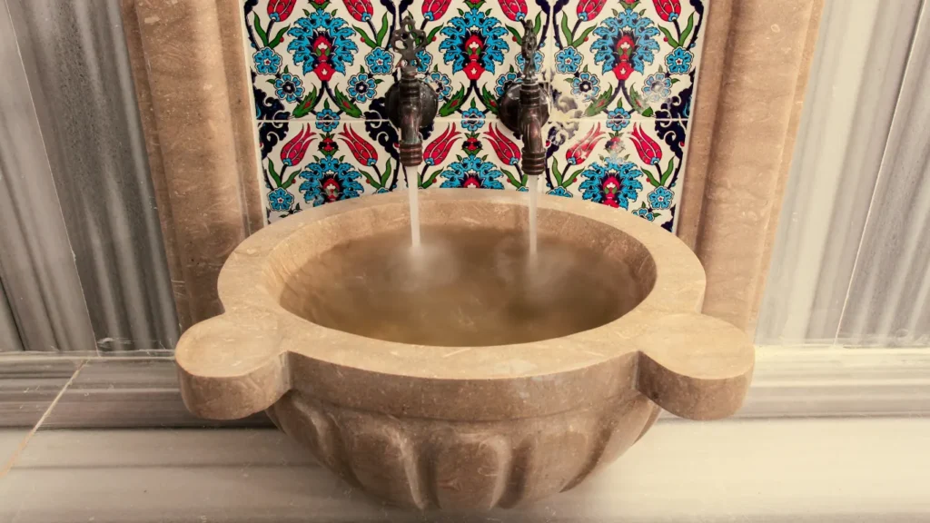 Therapist performing kese scrub in a traditional hammam Istanbul