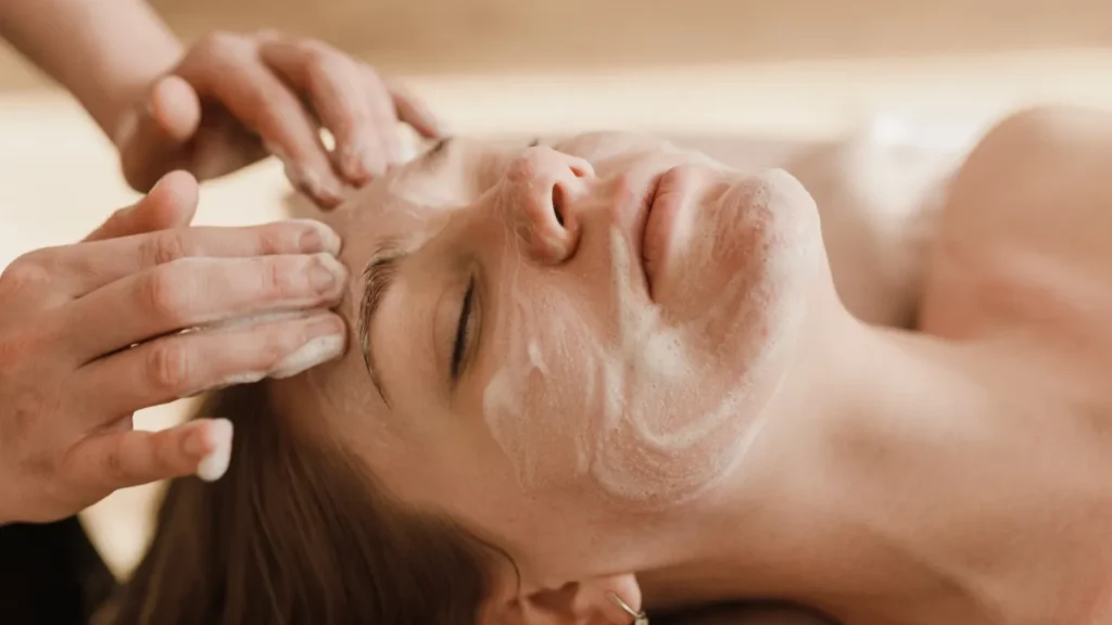 Facial treatment in a day spa with soothing ambient lighting