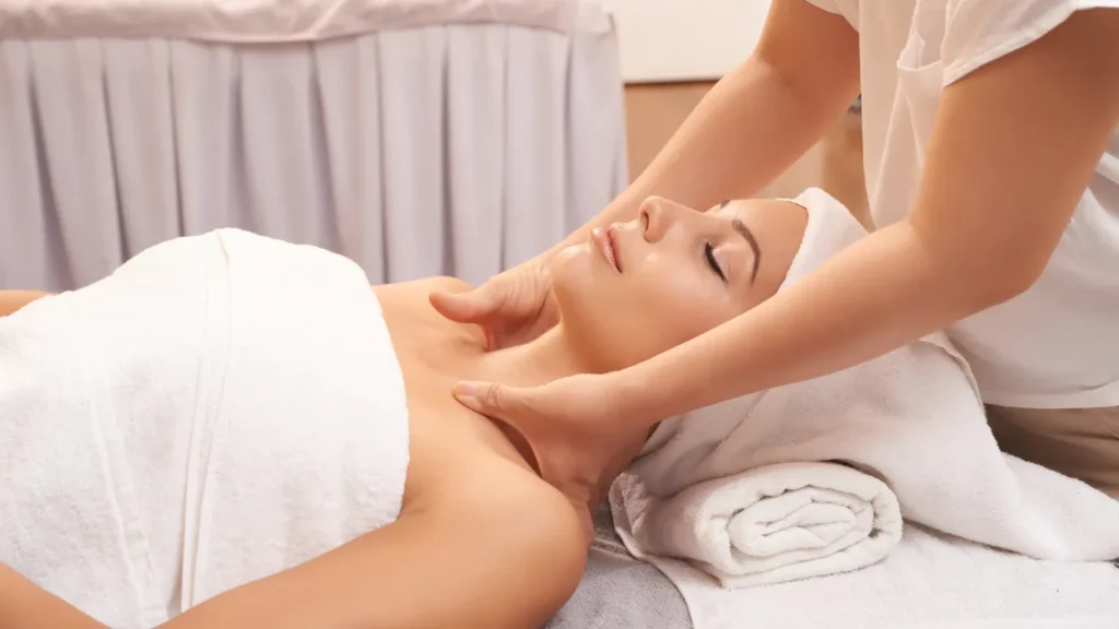 Couple enjoying side-by-side deep tissue massage in private suite
