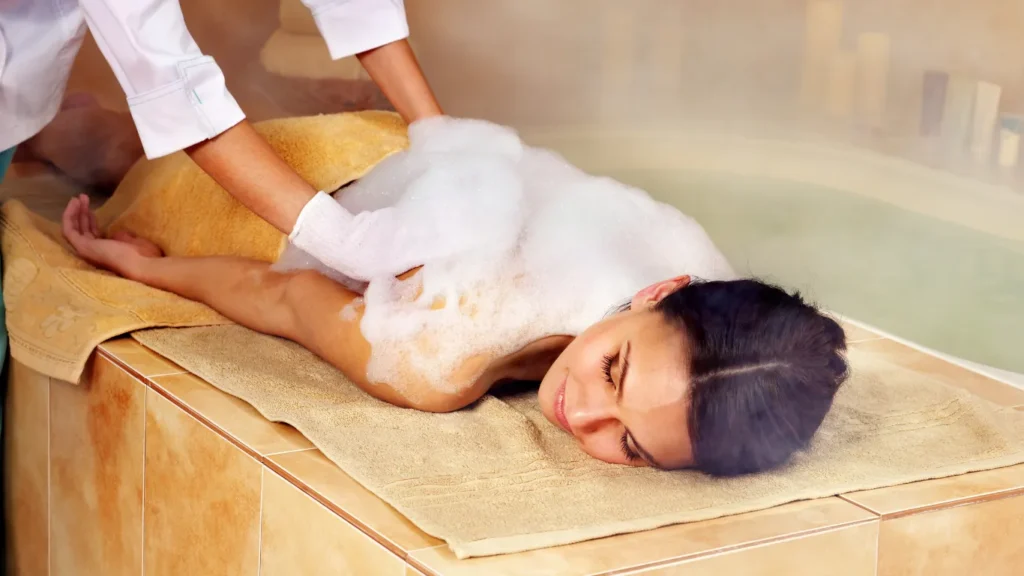 Couple enjoying private hammam with rose petals