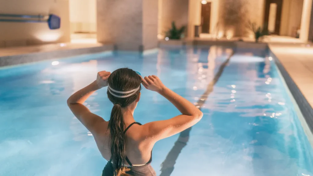 Couple enjoying side-by-side massage in private spa suite