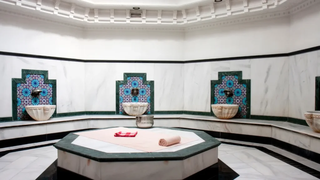 Couple enjoying VIP hammam experience with rose petals