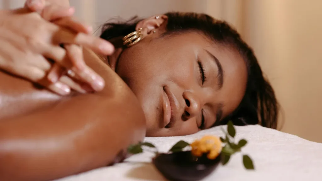 Therapist preparing essential oils for aromatherapy
